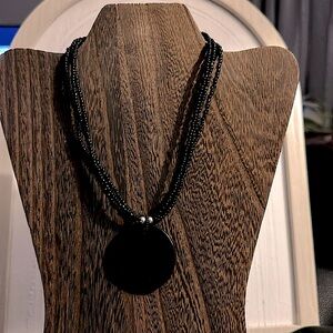Black Glass Pendant on Black Seed Bead 3 strand necklace.